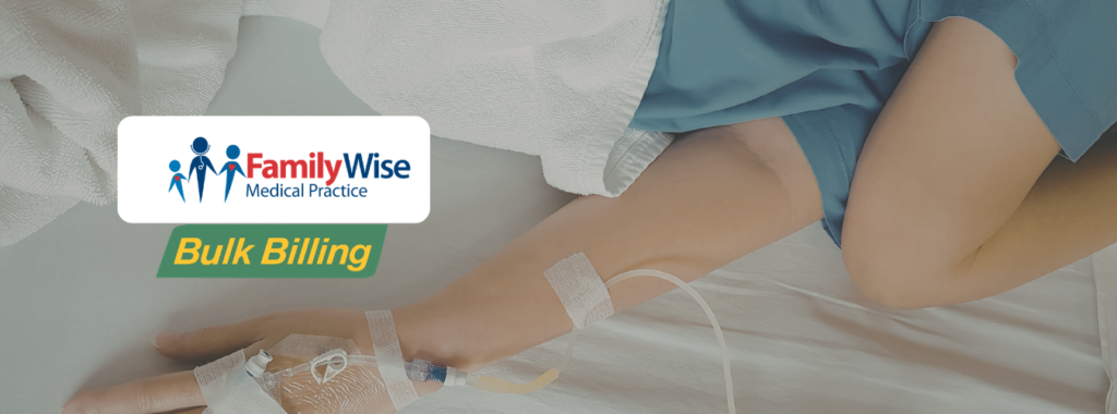 Verticle feature image titled: Iron Infusion Clinic Bella Vista with the FamilyWise Medical Centre logo front and centre of the screen, with a semi-transparent background image of iron infusion patient.
